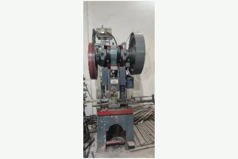 Industrial press machine at Hospitime manufacturing facility